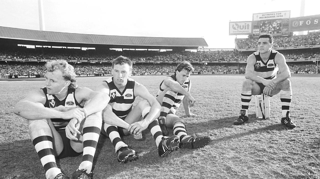 footy players sitting on the field